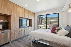 Bedroom featuring wood finished floors and recessed lighting