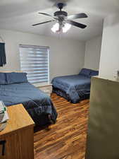 Bedroom featuring wood finished floors and ceiling fan