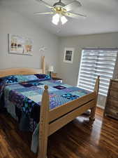 Bedroom featuring wood finished floors and a ceiling fan
