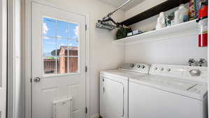 Clothes washing area featuring independent washer and dryer