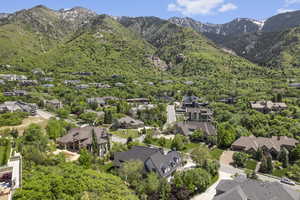 Aerial perspective of suburban area with a mountainous background