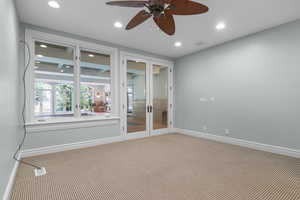 Room featuring french doors, carpet flooring, a ceiling fan, recessed lighting, and baseboards