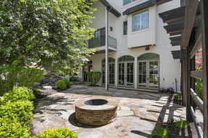 View of patio / terrace with an outdoor fire pit and french doors