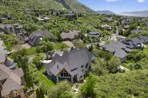 Aerial perspective of suburban area featuring a mountain backdrop