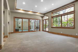 Room featuring ornamental molding, baseboards, light colored carpet, and recessed lighting