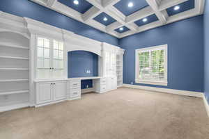 Room with light colored carpet, recessed lighting, coffered ceiling, beam ceiling, and baseboards