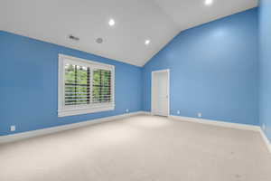 Carpeted spare room with lofted ceiling, recessed lighting, and baseboards