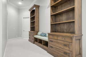 Mudroom featuring crown molding, carpet flooring, baseboards, and recessed lighting