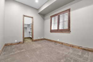 Room featuring carpet flooring and baseboards