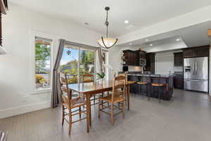 Dining area featuring baseboards and recessed lighting