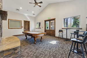 Recreation room featuring carpet, pool table, high vaulted ceiling, ceiling fan, and recessed lighting