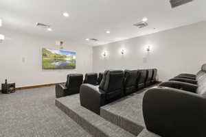 Cinema room with carpet, recessed lighting, and baseboards