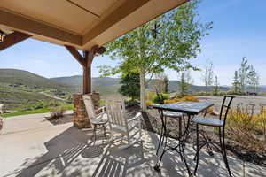 View of patio / terrace with a mountain view and outdoor dining area