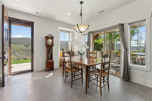 Dining room with baseboards and recessed lighting