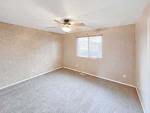 Primary bedroom with ample natural light and view of the backyard