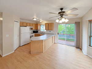Kitchen and dining room featuring sliding door to the deck for overflow eating areas for entertaining