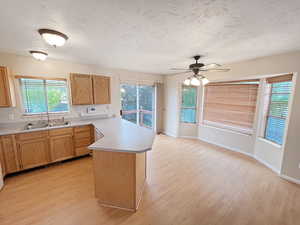 Kitchen and dining room featuring sliding door to the deck for overflow eating areas for entertaining