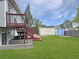 Tastefully designed backyard with lovely mature trees and large storage sheds for outdoor storage