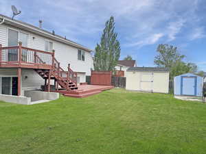 Tastefully designed backyard with lovely mature trees and large storage sheds for outdoor storage