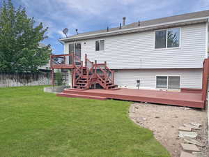 Tastefully designed backyard with lovely mature trees and large storage sheds for outdoor storage