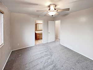 Primary bedroom boasting cozy new carpet, and with direct access to the full bathroom