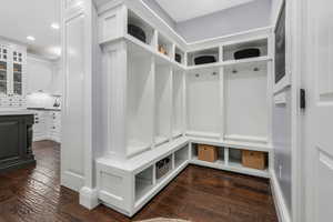 Mudroom featuring dark wood-type flooring and recessed lighting
