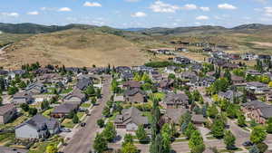 View of property location featuring nearby suburban area and mountains