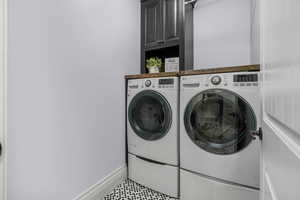 Laundry room with cabinet space and separate washer and dryer