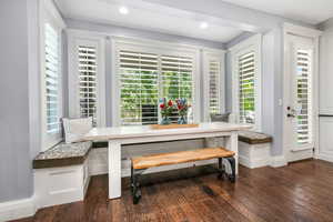 Dining area featuring breakfast area, dark wood-style floors, and recessed lighting