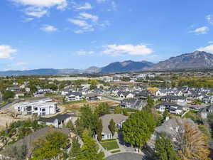 Aerial perspective of suburban area featuring a mountainous background