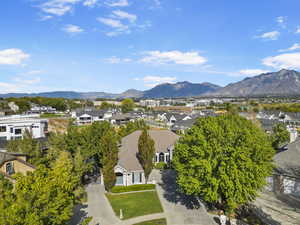 Aerial perspective of suburban area with a mountainous background
