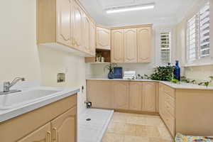 Laundry area with hookup for a washing machine and cabinet space