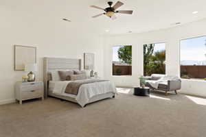 Bedroom featuring light colored carpet, baseboards, recessed lighting, and a ceiling fan