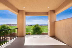 Balcony featuring a mountain view and a rural view