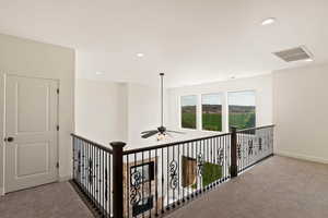 Hall featuring carpet floors, recessed lighting, and baseboards