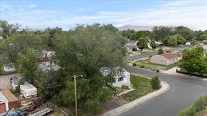 Aerial perspective of suburban area featuring a mountain backdrop