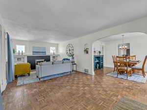 Front entry shows beautiful original hardwood floors throughout the front of the home