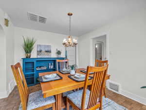 This craftsman style table and chairs, as well as the buffet cabinet on the wall, are staying