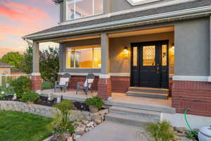Covered front porch and flower beds