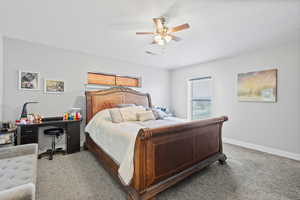 ADU primary bedroom featuring light carpet, two-tone paint and ceiling fan