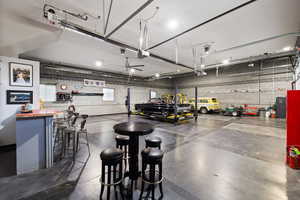 Detached 12-Car heated shop with 14' RV door, dry bar, and bathroom