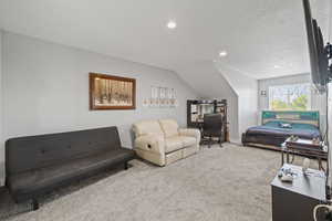 ADU carpeted bedroom featuring recessed lighting and two-tone paint