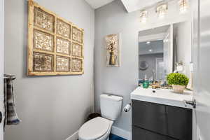 ADU 1/2 bath featuring modern vanity and toilet