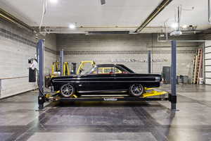 View of finished shop featuring a car lift