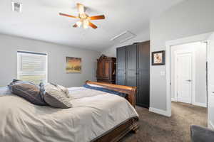 ADU primary bedroom featuring light carpet, two-tone paint and ceiling fan