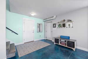 ADU entrance foyer with stairway, and finished concrete floors