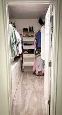 Spacious Master closet featuring carpet floors