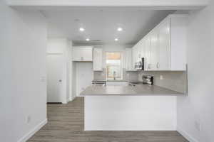 KChop, sauté, and sip in this cozy townhome kitchen with plenty of cabinet space and a sleek quartz island—perfect for meal preps and midnight snacks!