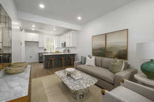 A stylish, light-filled living area that’s perfect for unwinding or hosting a few close friends. *Model