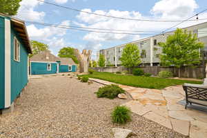 View of secluded yard with professional landscaping, flagstone walkways and patio area